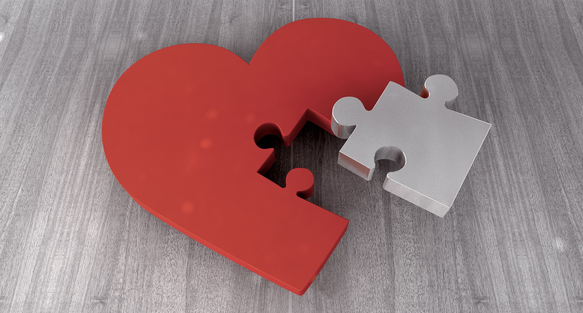 Corazón rojo con una pieza de puzle separada, símbolo de una voz de marca incoherente entre mercados.